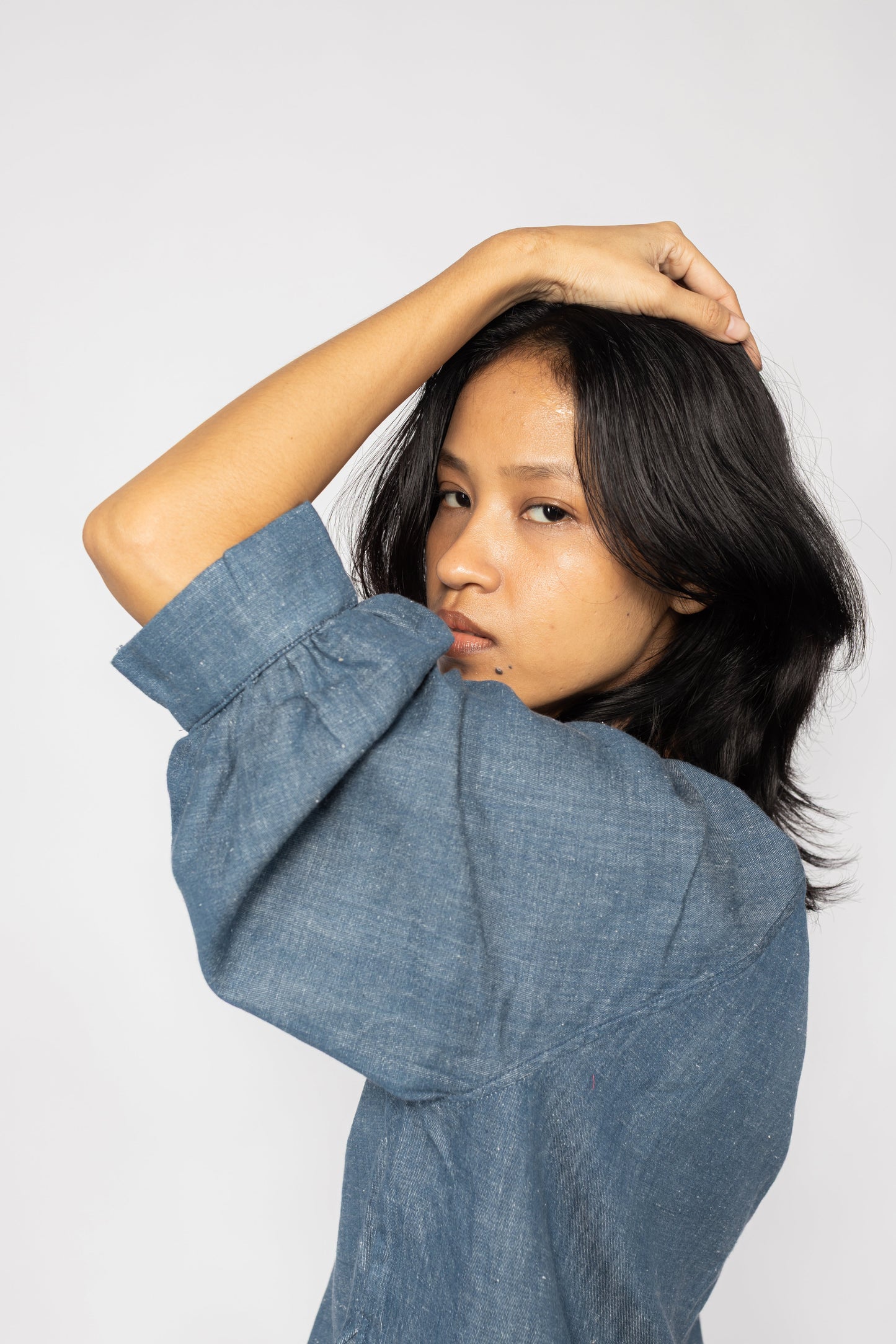 Plains Design - Sault wide sleeved top. Side closeup of blue denim wide sleeved top in a relaxed fit. Ethically handmade in India with handspun cotton twill denim.